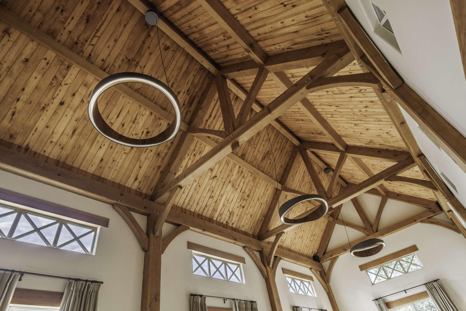 Vaulted timber-frame ceiling with pendant lights