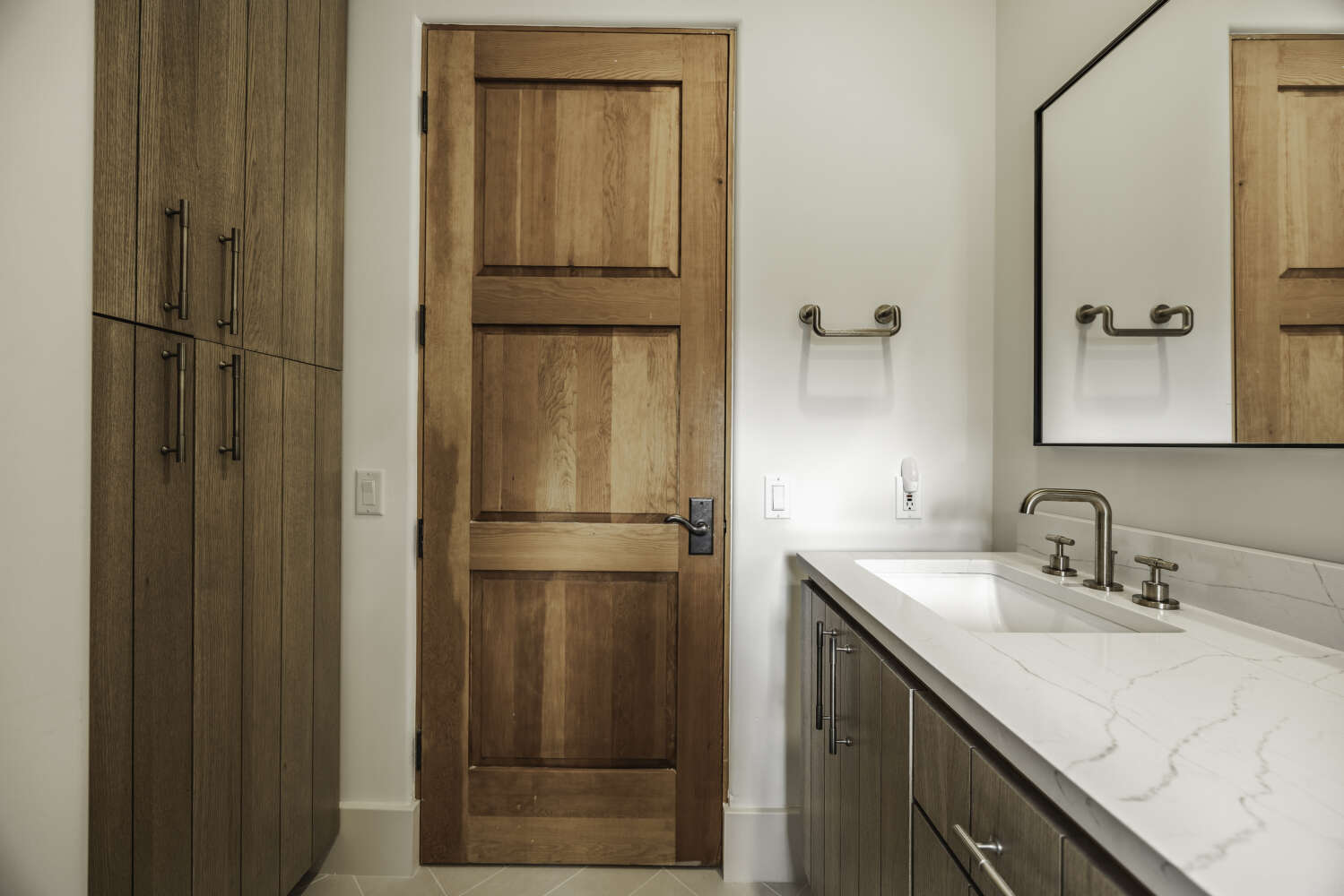 Secondary bathroom vanity and linen storage