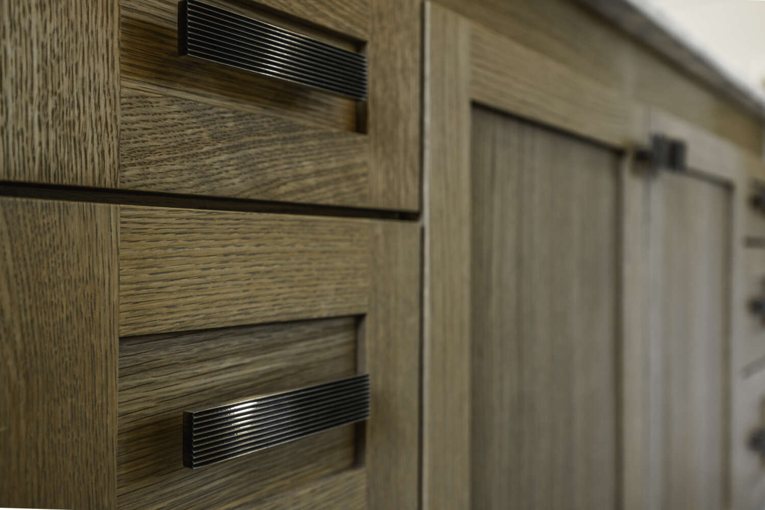 Cabinet hardware detail — ribbed bin pulls
